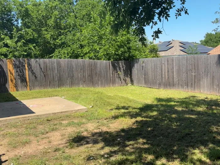 Back yard lawn and timber deck tidied up under shade trees