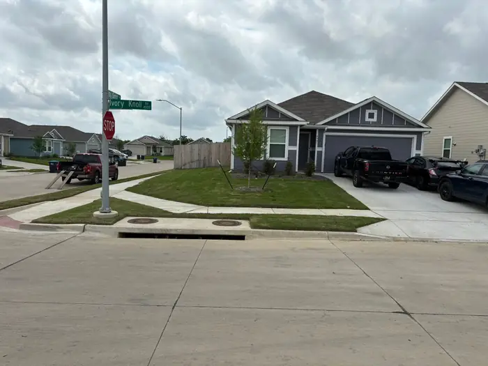 Corner property with the lawn mowed right around to the side street