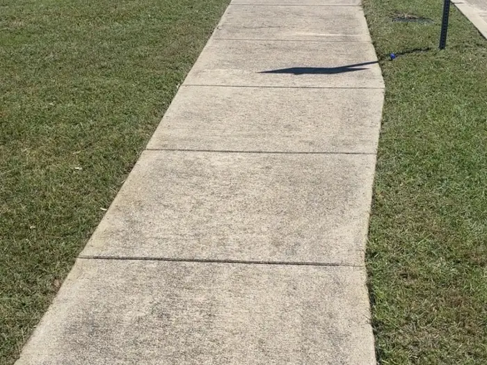Footpath running between two mown grass strips, cleanly edged